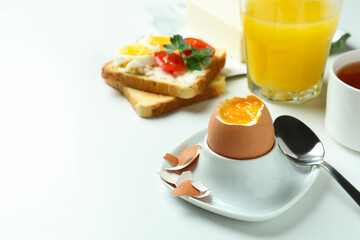 Concept of tasty breakfast with boiled egg, space for text