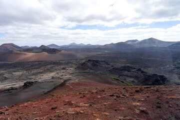 Fototapeta na wymiar Unique volcanic landscapes of Timanfaya National Park. Lanzarote, Canary islands