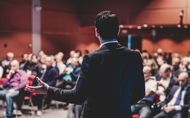 Speaker giving a talk at business conference meeting.