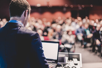 Speaker giving a talk at business conference meeting.