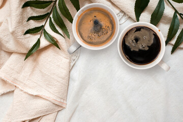 closeup black coffee cup put on linen fabric. top view