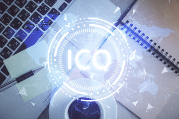 Blockchain theme hologram drawings over computer on the desktop background. Top view. Double exposure.