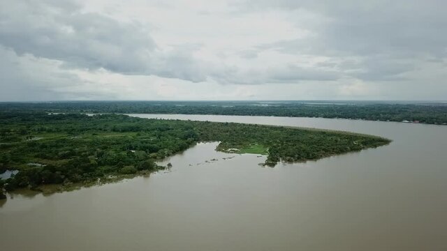 Amazon River bordered by thick jungle in Peru's Loreto Region - Aerial