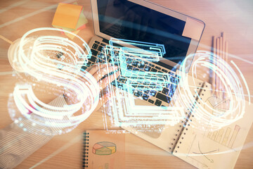 Multi exposure of man's hands typing over computer keyboard and SEO hologram drawing. Top view....