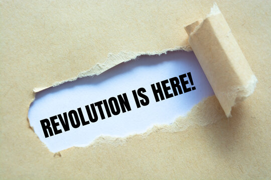 Text sign showing Revolution is Here 