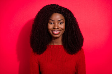 Portrait of attractive cheerful brunet girl wearing pullover isolated over vivid red color background