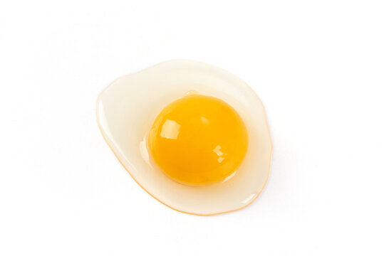 Raw egg yolk isolated on white background