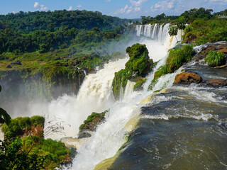Fototapeta na wymiar Massive water flow down and make a rainbow at Iguazu Falls, Argentina. Beautiful nature scenic picture took as 4x3 ratio and 6000 by 4500 pixels.