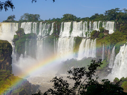 Massive water flow down and make a rainbow at Iguazu Falls, Argentina. Beautiful nature scenic picture took as 4x3 ratio and 6000 by 4500 pixels.