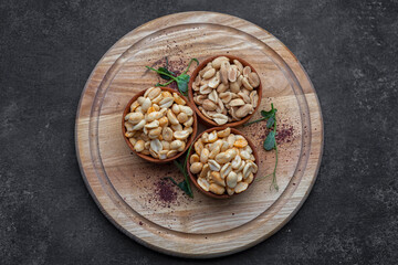 Roasted peanuts for beer, on a dark background