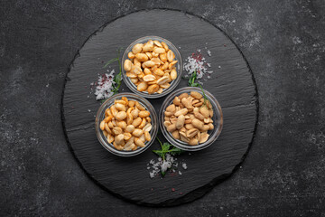 Roasted peanuts for beer, on a dark background