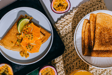 Crepes Or Thin Pancakes With Delicious passion fruit and lime.