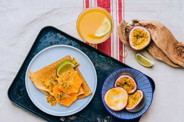 Crepes Or Thin Pancakes With Delicious passion fruit and lime.