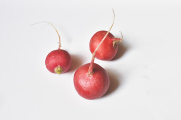 Radish in the amount of three pieces on a white background