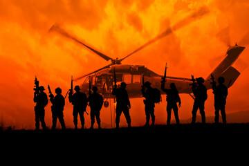 Fototapeta na wymiar Team special forces.Silhouette action soldiers hold weapons.military and danger concept.