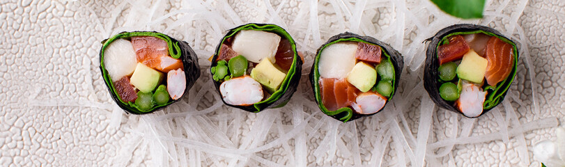 Top view of healthy Japanese sushi roll without rice with crab meat wrapped in daikon radish