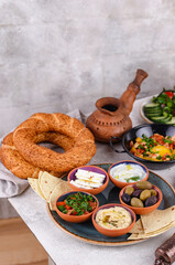 Fototapeta na wymiar Traditional Turkish breakfast with meze and simit