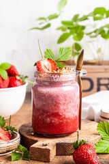 Strawberry chia pudding in glass jar.