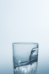 Splash, splashing water in a glass on a white background