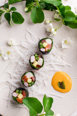 Top view of healthy Japanese sushi roll without rice with crab meat wrapped in daikon radish