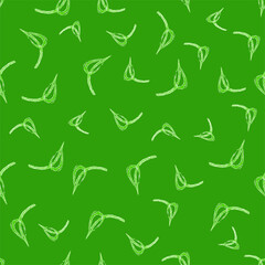 Leaves on a green background. Summer and spring ornament. Seamless pattern. For textiles, wallpapers and backgrounds.