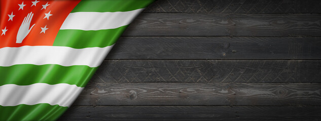 Abkhazian flag on black wood wall banner