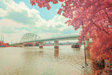 This is a landscape photo infrared. The picture was taken in Ho Chi Minh City, 13/4/2021. Content about architecture of Binh Loi bridge. This is a famous bridge in Ho Chi Minh city.