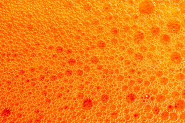 beer foam texture close up , porous ale bubble background macro , colored bar lager backdrop