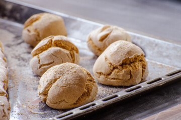 freshly baked bread on the dark table