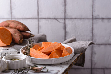 Raw sweet potato with herbs and garlic