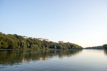cottages on the high hill on the river in the trees