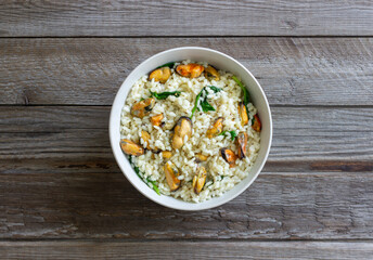 Risotto with mussels and spinach. Healthy food. Vegetarian food.
