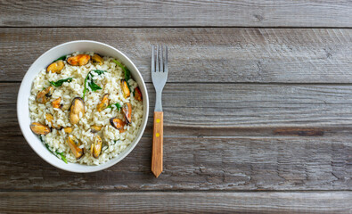 Risotto with mussels and spinach. Healthy food. Vegetarian food.