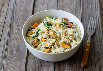 Risotto with mussels and spinach. Healthy food. Vegetarian food.