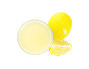 Freshly squeezed juice and lemons on white background, top view