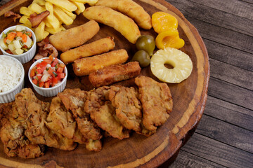 Cuban fillet. Made with breaded Steak, cheese, breaded ham and banana, Vinaigrette, white rice,...
