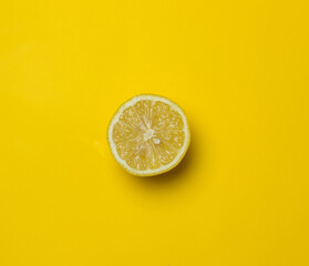 half lemon on a yellow background