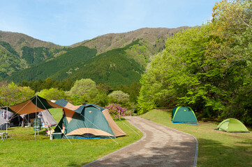 Camping Tents in Fuji-Hakone-Izu National Park. Lake Tanuki Campground in Fujinomiya City, Shizuoka Prefecture, Japan.