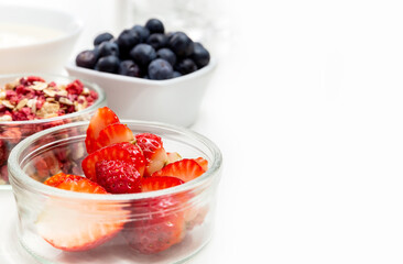 Ingredients for a healthy breakfast. Muesli, berries and yogurt. Healthy eating. Sports fitness menu. Concept. Copy space