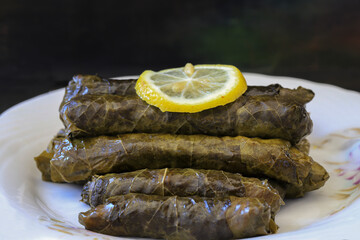 grape leaves, stuffed grape leaves, traditional food, dolmalar, sarmale, stuffed, lemon slices, appetizer