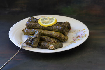 grape leaves, stuffed grape leaves, traditional food, dolmalar, sarmale, stuffed, lemon slices, appetizer