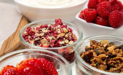 Ingredients for a healthy breakfast. Muesli, berries and yogurt. Healthy eating. Sports fitness menu. Concept.
