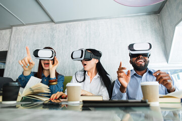 Advanced digital 3d virtual reality technology. Cheerful surprised three multiracial friends...