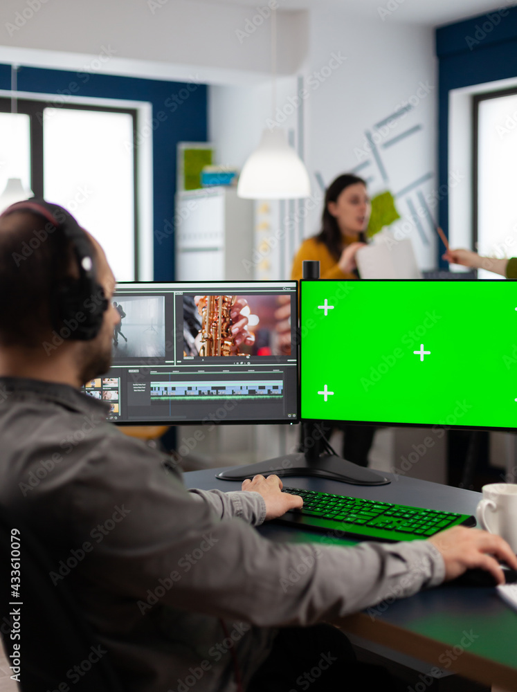 Poster video editor processing movie montage cutting footage at pc with green screen, chroma key, mock up i