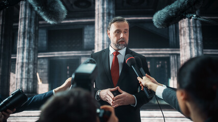 Organization Representative Answering Press Questions and Giving Interview Outside a Parliament, Court or Other Government Building. Press Officer or Businessman Crowded by News Journalists. 