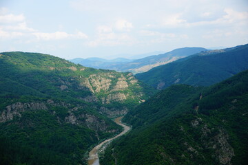Fototapeta na wymiar River flowing between mountains