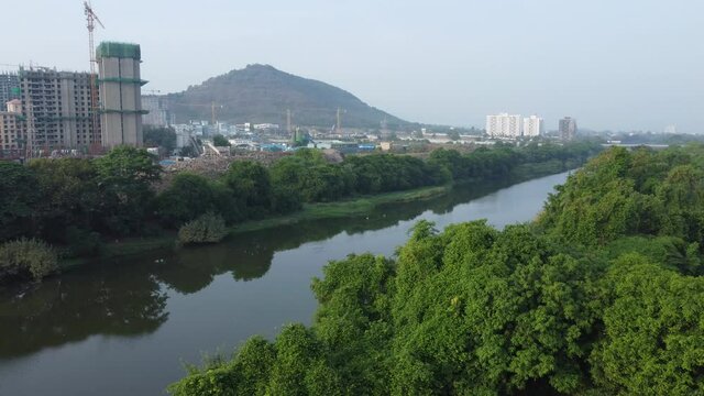 Construction activity along the banks of the river Mutha at Pune India.
