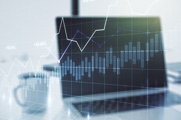 Multi exposure of abstract financial graph on laptop background, financial and trading concept