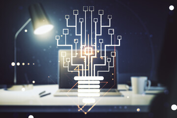 Double exposure of creative light bulb hologram with chip on laptop background, idea and brainstorming concept