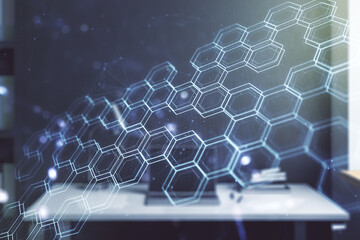 Obraz premium Double exposure of technology hologram with hexagon and modern desktop with laptop on background. Research and development software concept